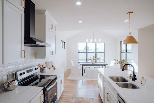 Industrial-style kitchen with exposed brick, metal accents, and modern fixtures